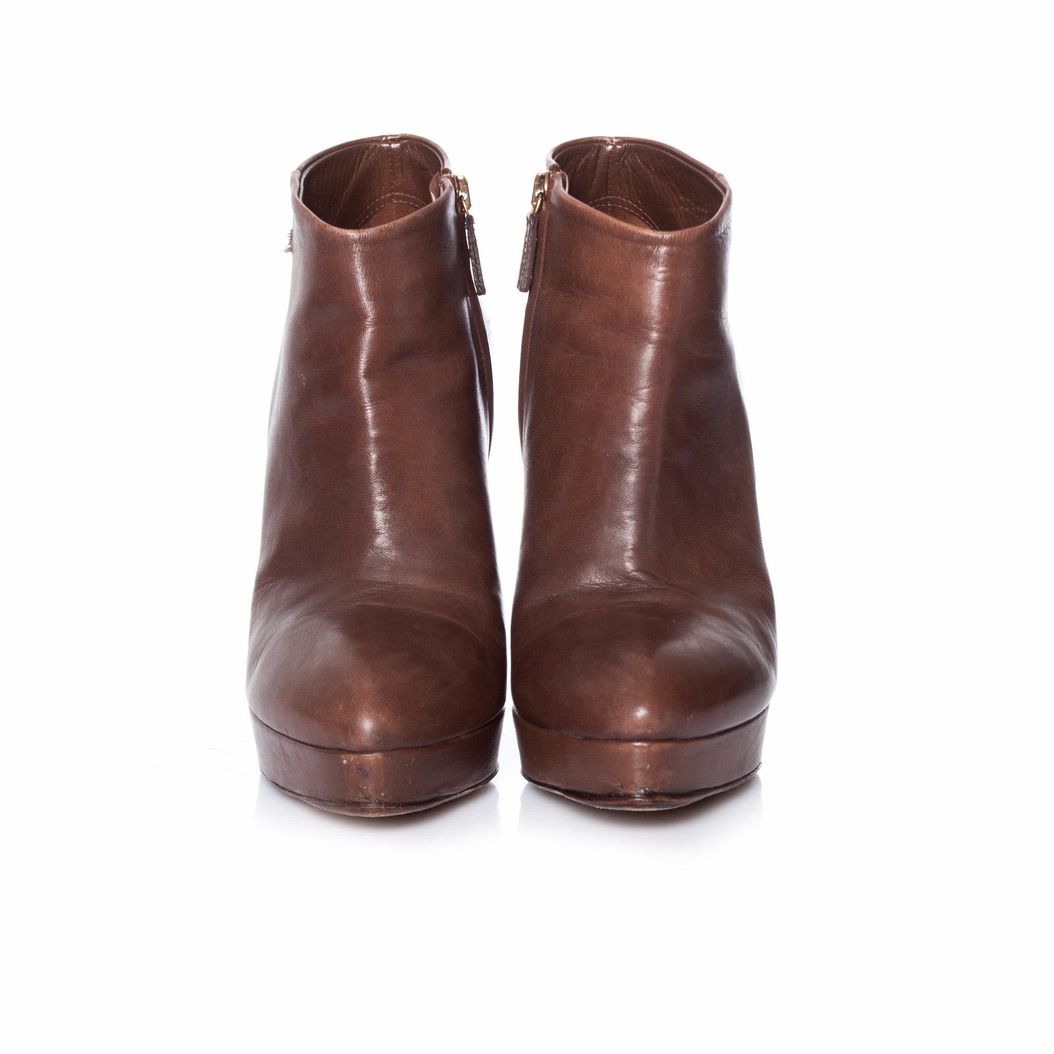 Women's Gucci Brown leather platform ankle boots.