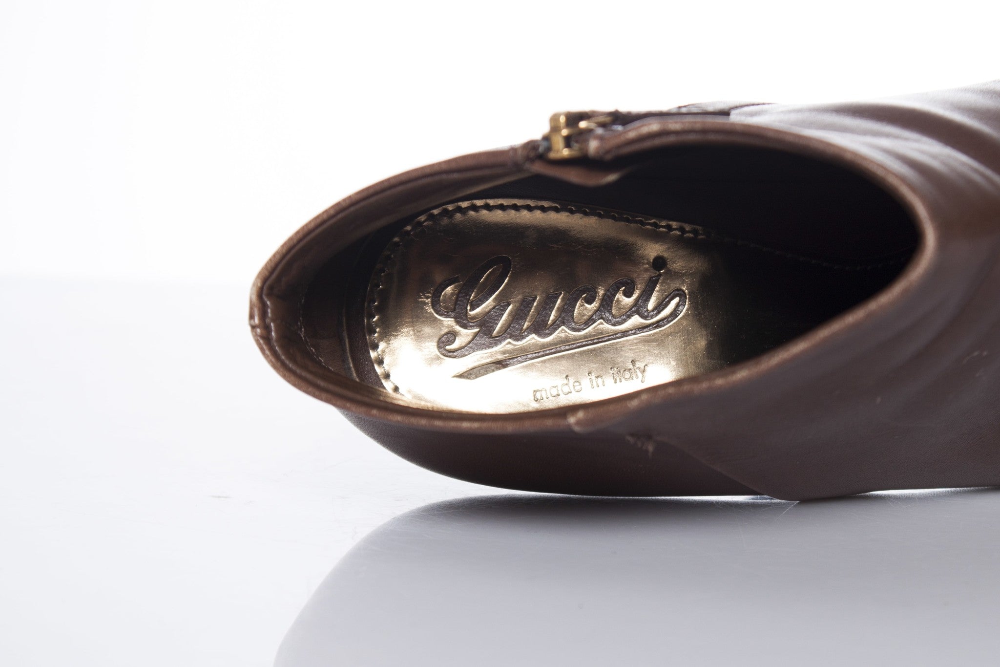 Women's Gucci Brown leather platform ankle boots.