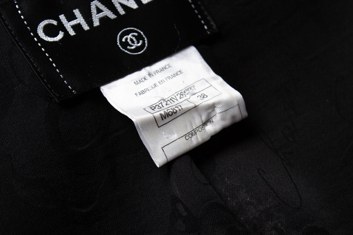 Women's Chanel black and gold tweed jacket