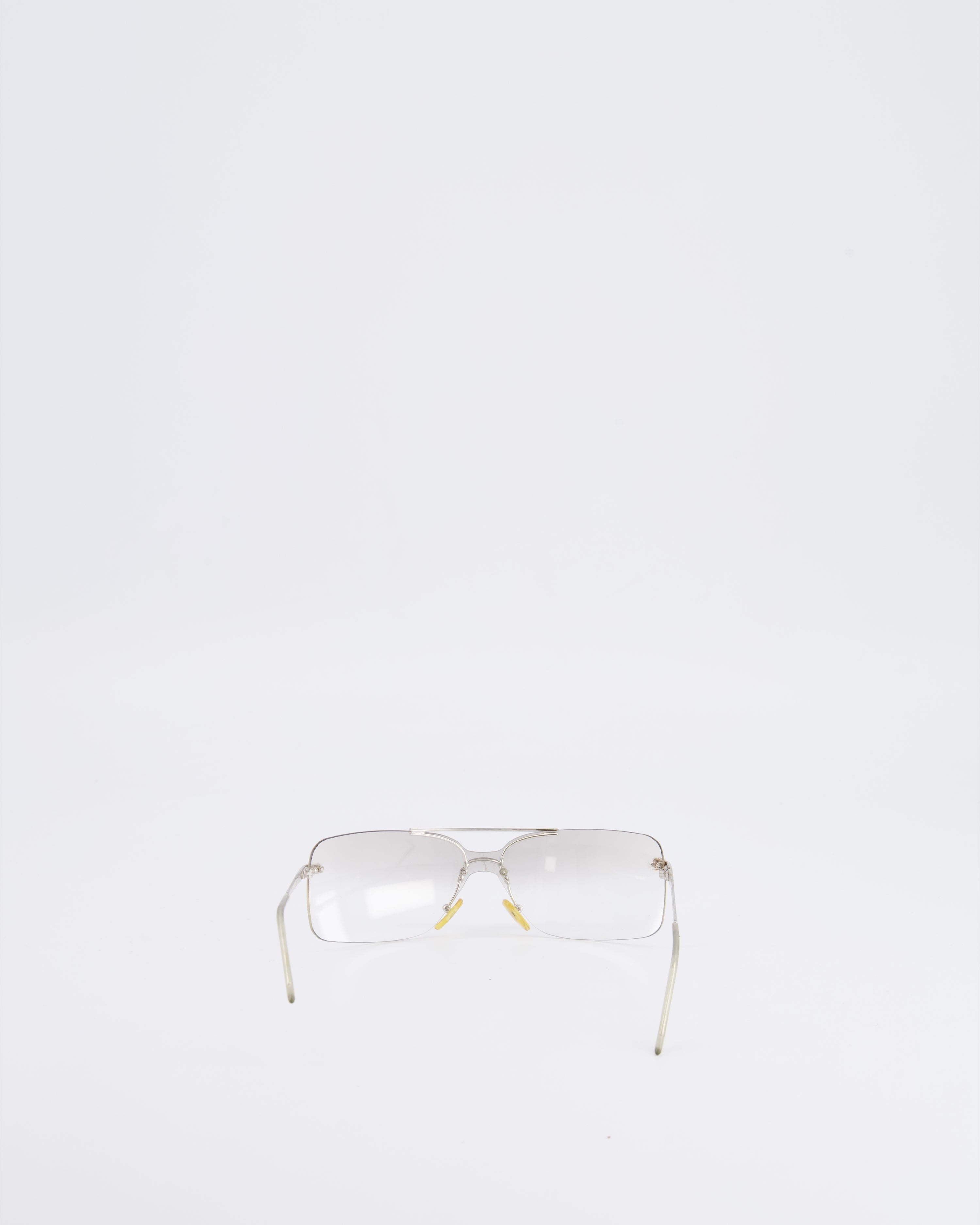 Christian Dior Vintage Transparent Rimless Shield-Lens Mini Motard Sunglasses with Silver Arms and Engraved Logo Detail