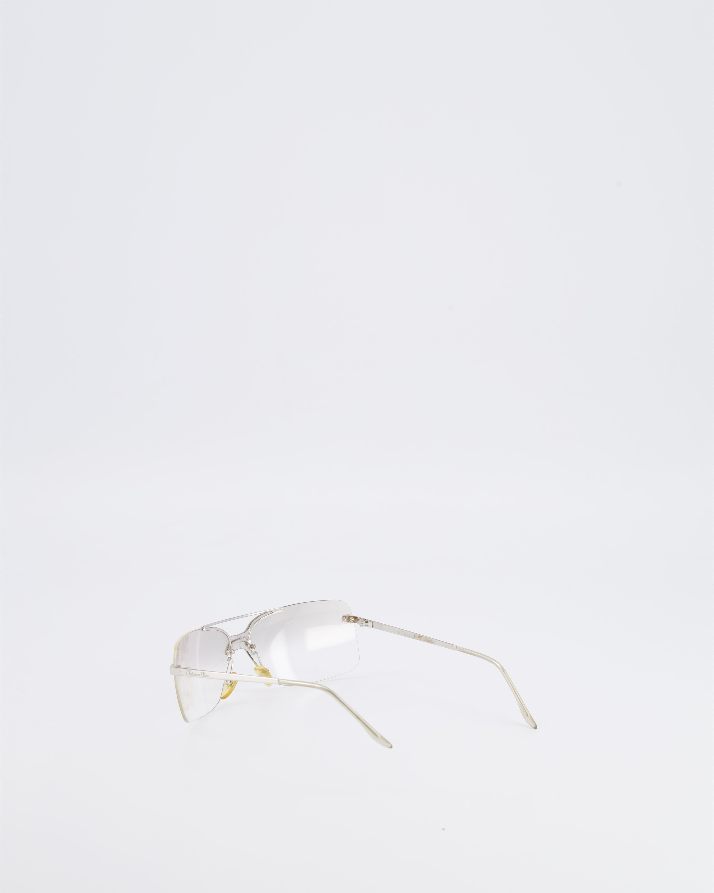 Christian Dior Vintage Transparent Rimless Shield-Lens Mini Motard Sunglasses with Silver Arms and Engraved Logo Detail