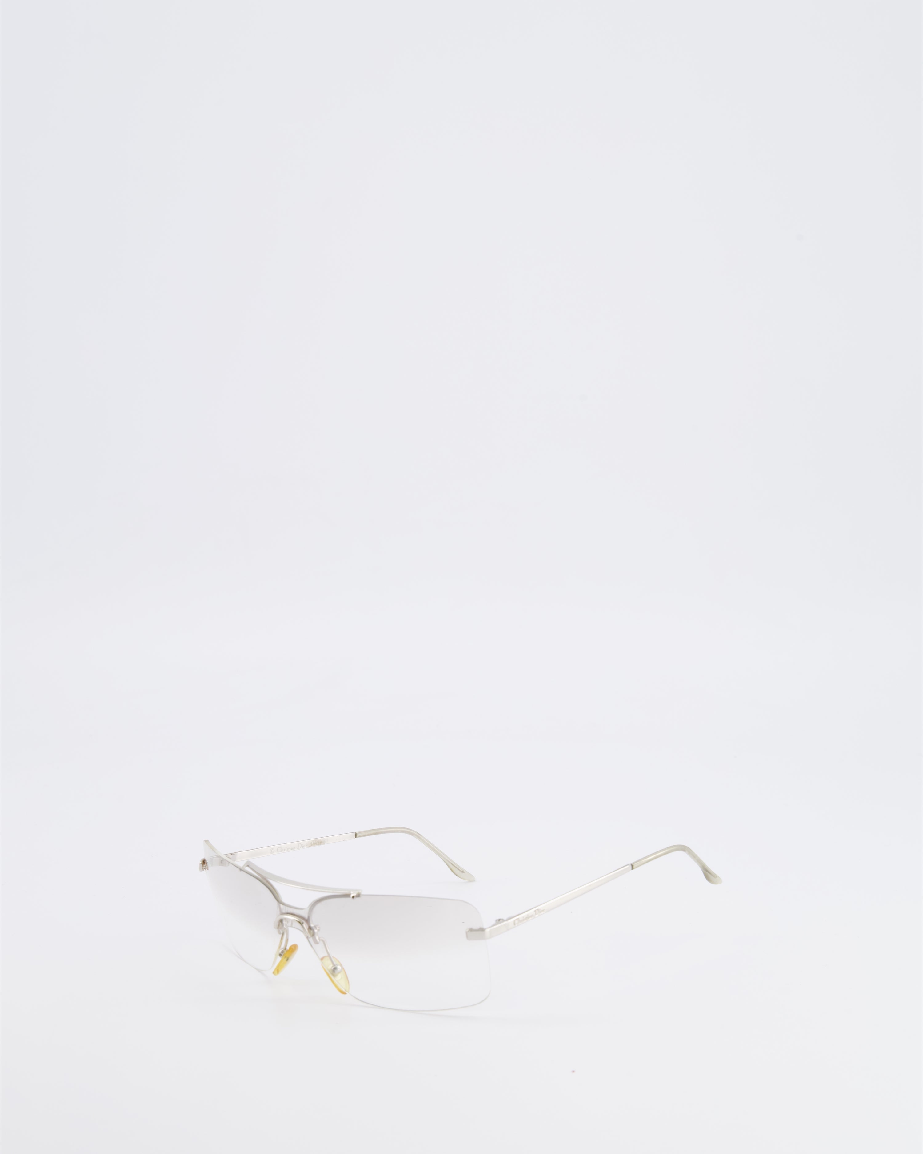 Christian Dior Vintage Transparent Rimless Shield-Lens Mini Motard Sunglasses with Silver Arms and Engraved Logo Detail