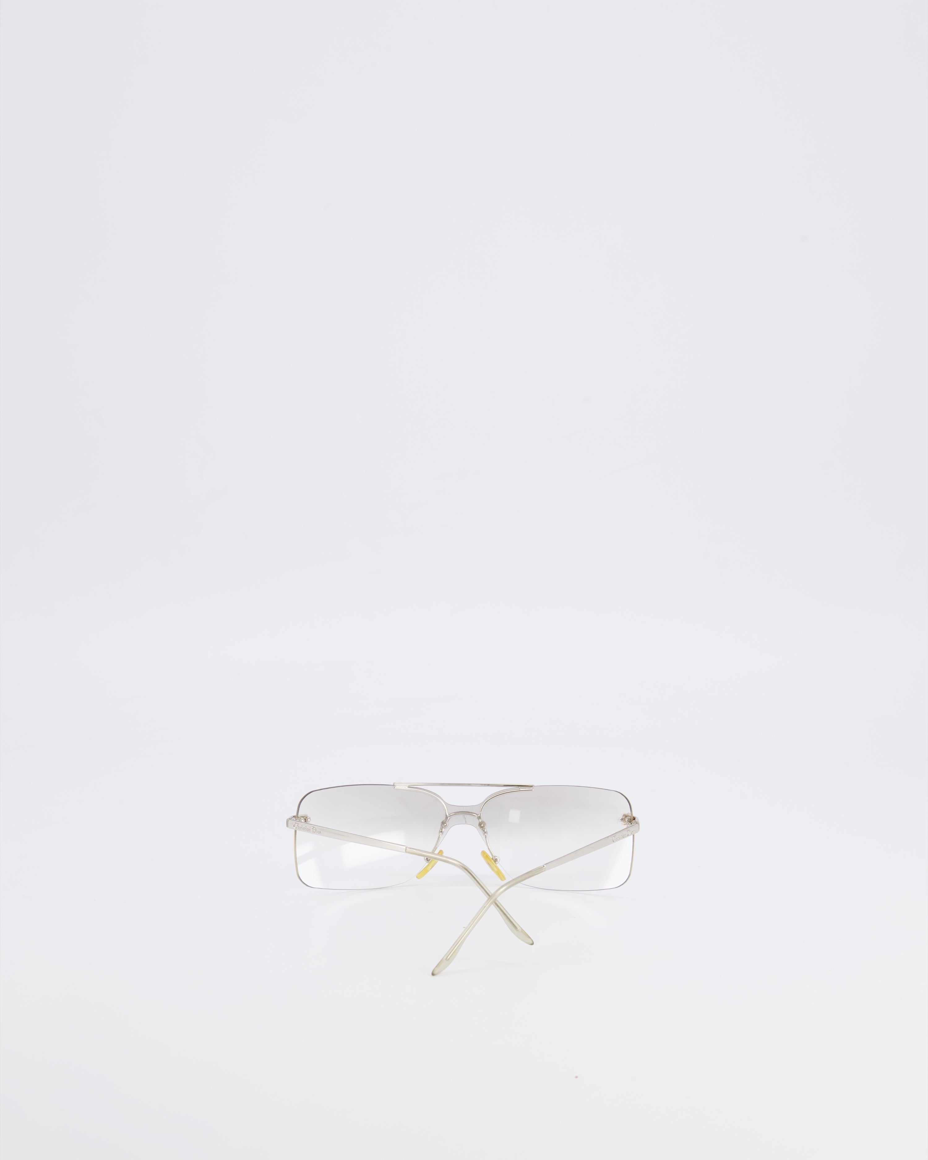 Christian Dior Vintage Transparent Rimless Shield-Lens Mini Motard Sunglasses with Silver Arms and Engraved Logo Detail
