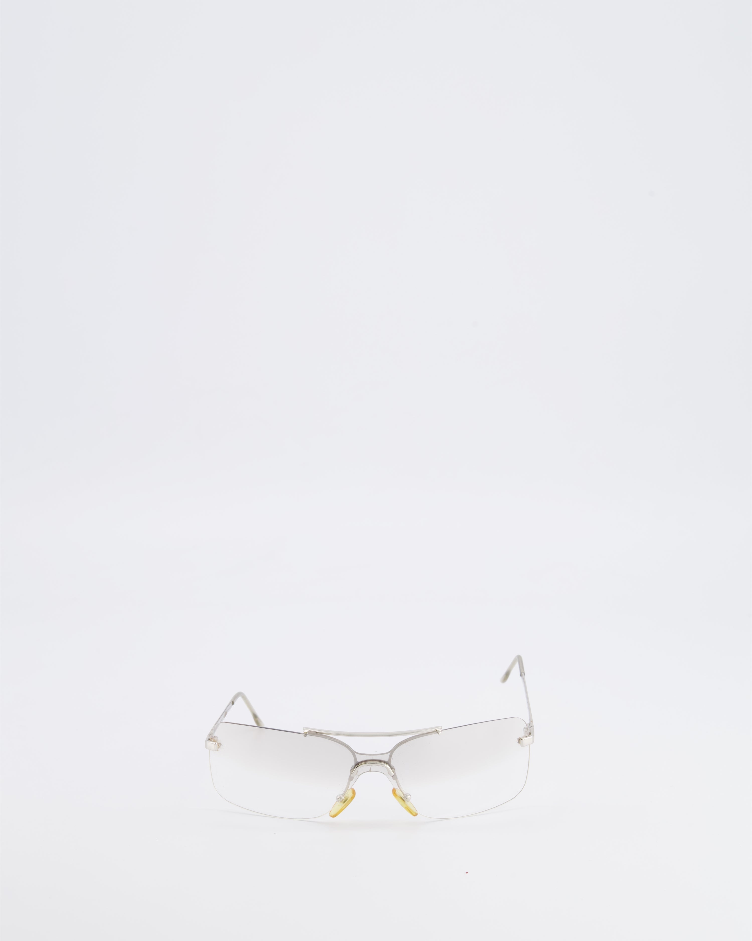 Christian Dior Vintage Transparent Rimless Shield-Lens Mini Motard Sunglasses with Silver Arms and Engraved Logo Detail