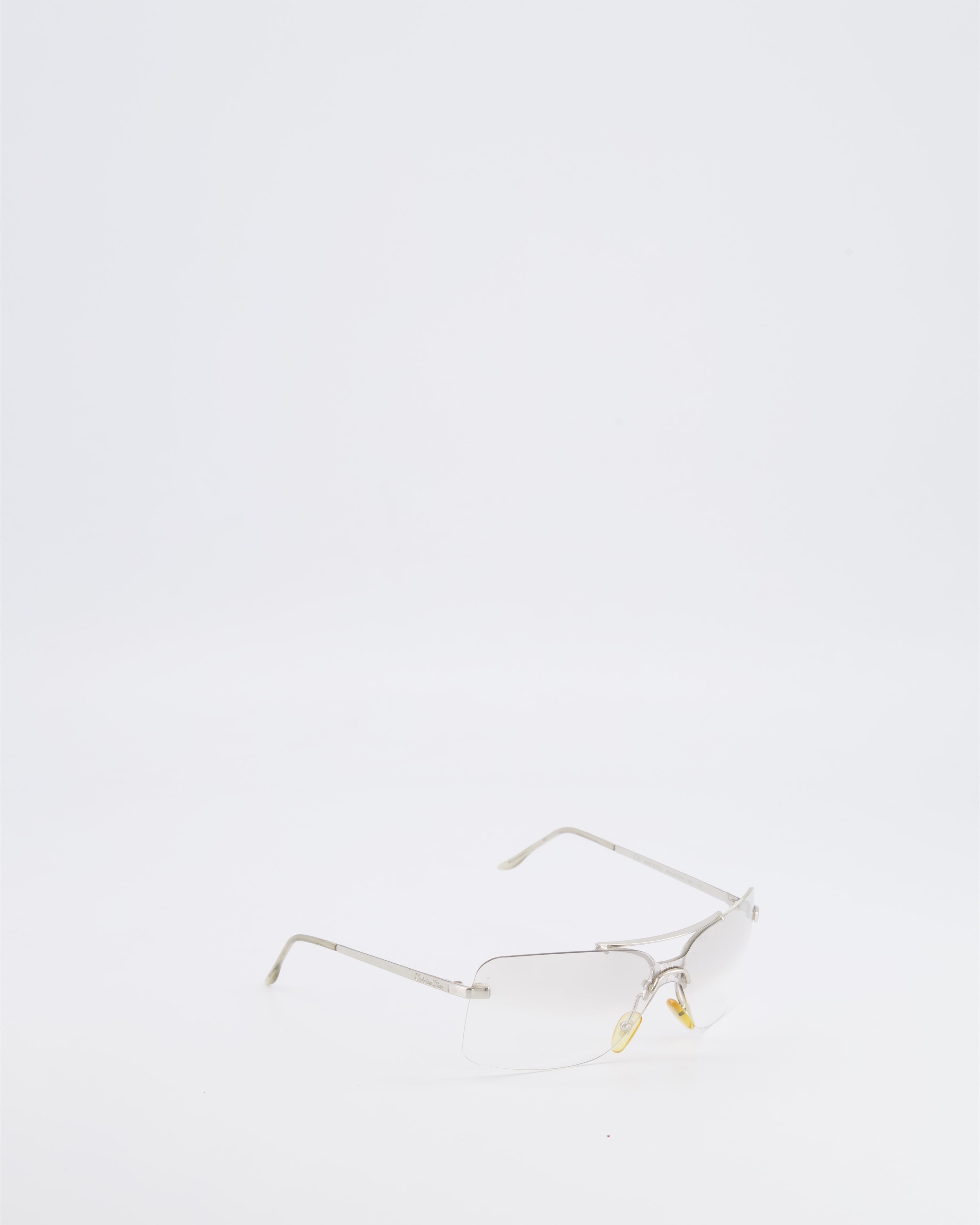 Christian Dior Vintage Transparent Rimless Shield-Lens Mini Motard Sunglasses with Silver Arms and Engraved Logo Detail
