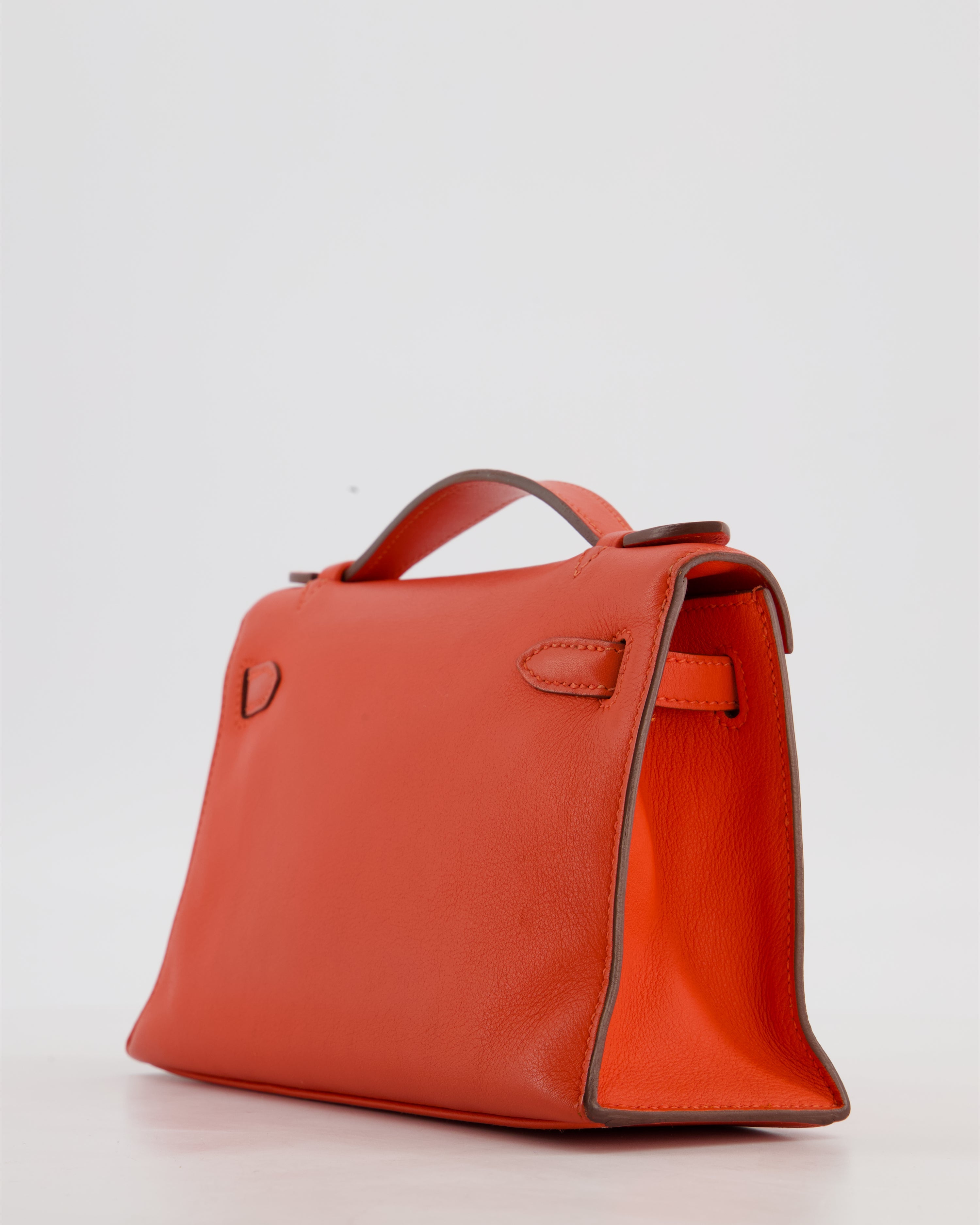 Hermès Kelly Pochette Bag in Capucine Swift Leather with Palladium Hardware