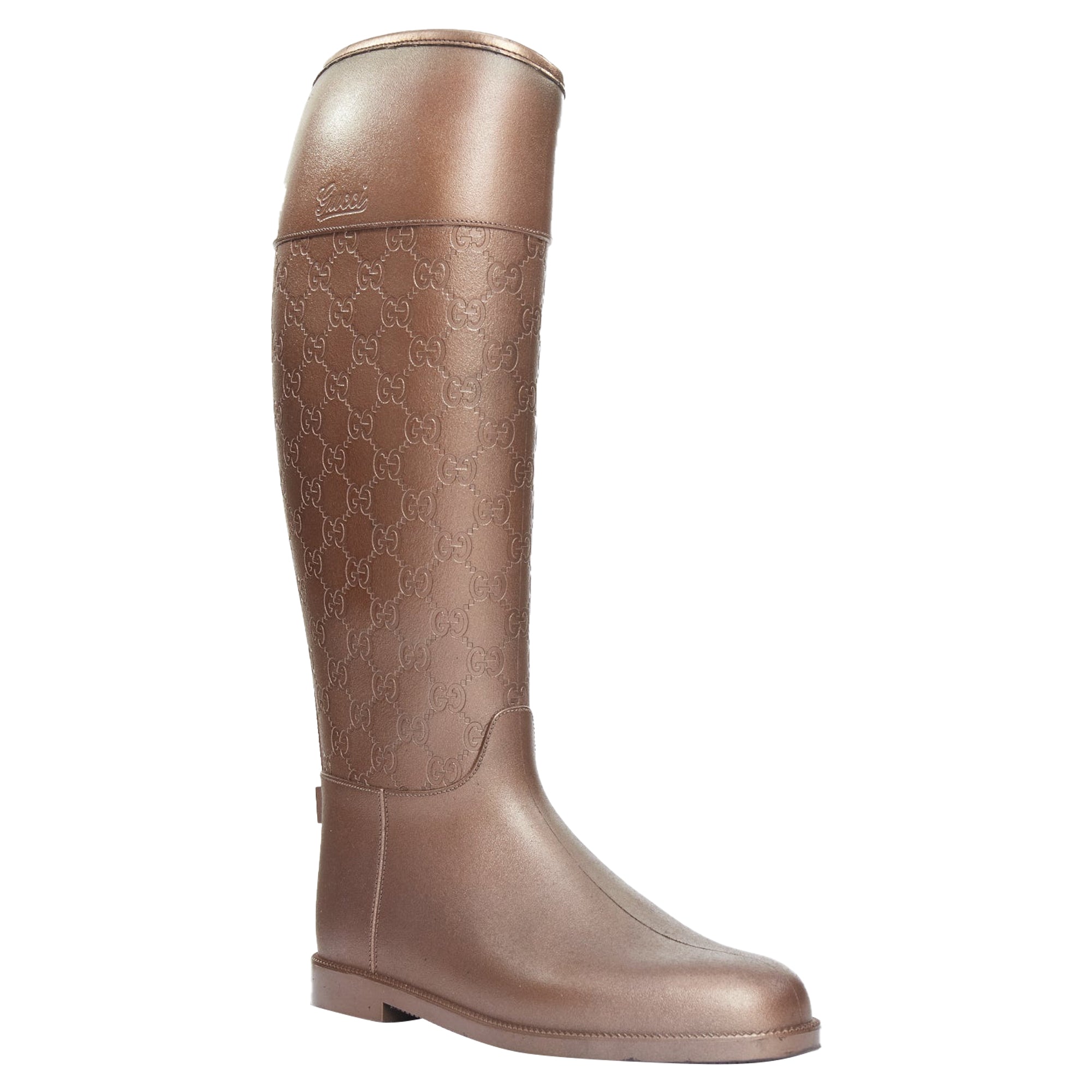 Women's Gucci bronze rubber rainboots