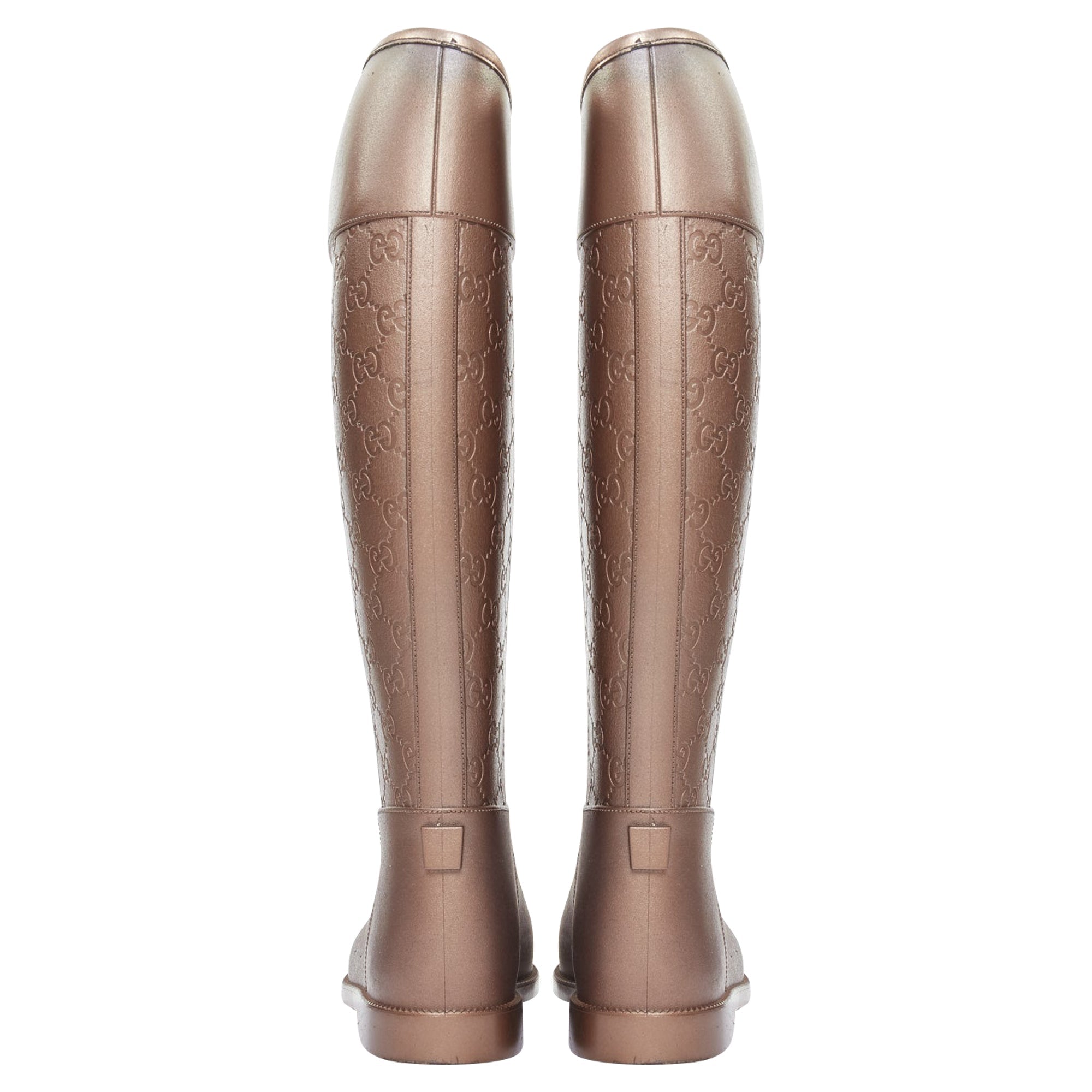 Women's Gucci bronze rubber rainboots