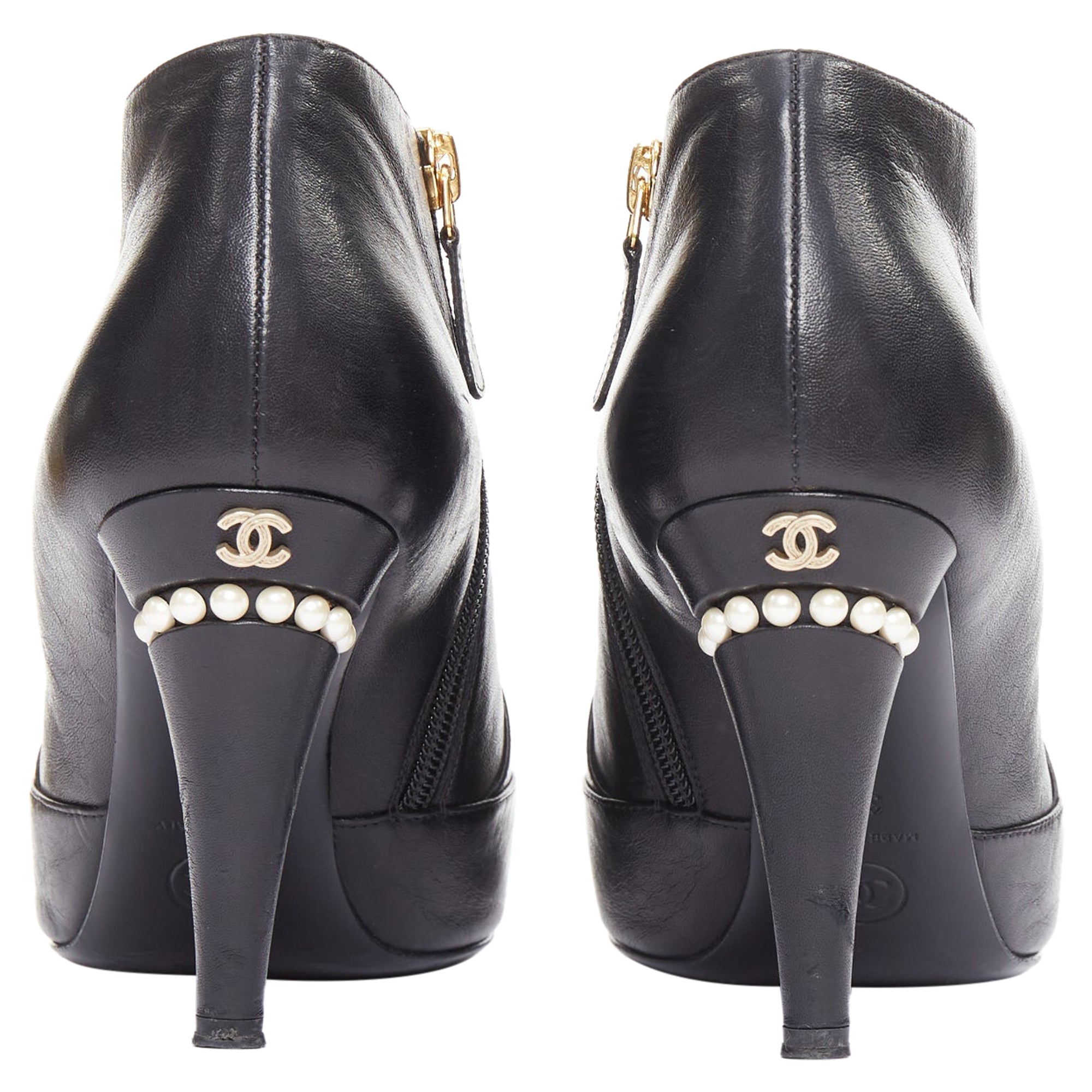 Women's Chanel black pearl ankle boots
